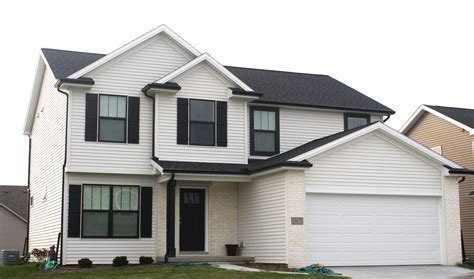 white siding with black gutters